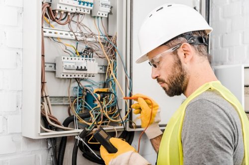 electrician working on power board