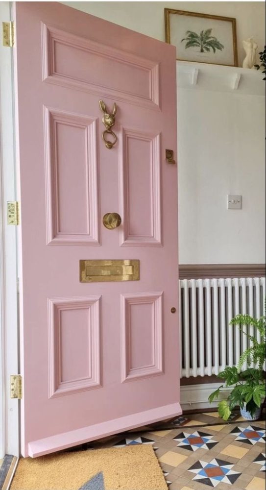 Pastel pink front door.