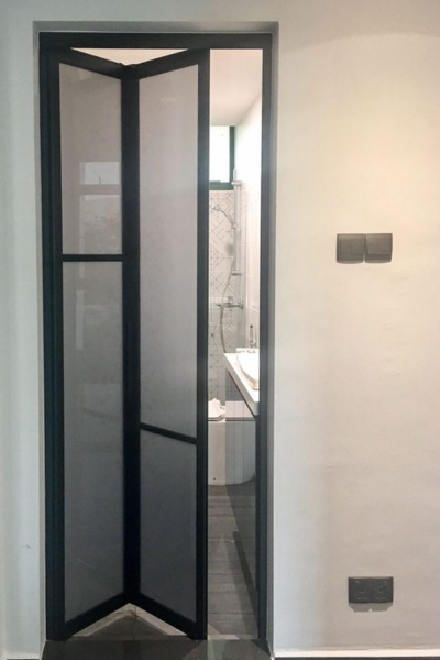 Bi-fold bathroom door with black frame.