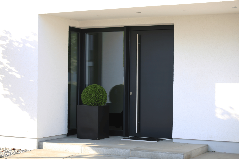 Modern black front door with side window that is double glazed.