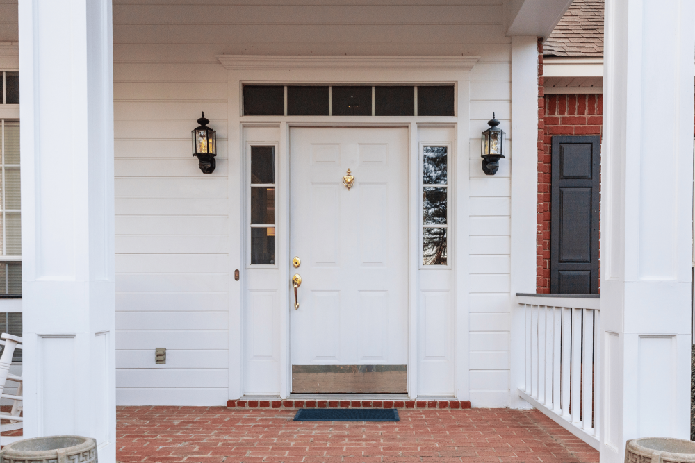 White front door with decorative features.