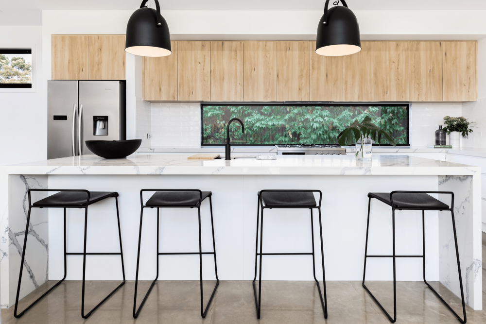 Modern kitchen with fixed window splashback.